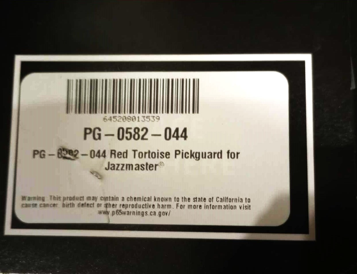 Allparts 13-hole Pickguard for US Jazzmaster® Red Tortoise .